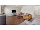 Spacious living room featuring hardwood floors and a comfortable tan leather couch at 3243 Shoals Park Dr, Decatur, GA 30034