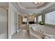 Spacious main bathroom with large soaking tub, tile floors, and separate shower at 525 Water Shadow Ln, Alpharetta, GA 30022