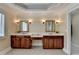 Ensuite bathroom with dual sink vanities and neutral color palette at 525 Water Shadow Ln, Alpharetta, GA 30022