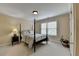 Comfortable bedroom with four-poster bed, neutral decor, and natural light at 525 Water Shadow Ln, Alpharetta, GA 30022