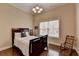 Bedroom with hardwood flooring, a single bed, and a classic wood chair by the window at 525 Water Shadow Ln, Alpharetta, GA 30022