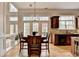Dining area featuring hardwood floors, large windows, and a chandelier at 525 Water Shadow Ln, Alpharetta, GA 30022