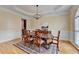 Formal dining room featuring classic wainscoting and decorative rug at 525 Water Shadow Ln, Alpharetta, GA 30022