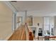 Upstairs hallway with hardwood floors, staircase and railing overlooking the living room below at 525 Water Shadow Ln, Alpharetta, GA 30022