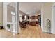 Spacious kitchen and breakfast nook with hardwood flooring, central island, and stainless steel appliances at 525 Water Shadow Ln, Alpharetta, GA 30022