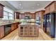 The kitchen has a central island, stainless steel appliances, and granite countertops at 525 Water Shadow Ln, Alpharetta, GA 30022