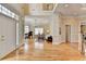 Spacious living room with hardwood floors, neutral walls, a grand piano, and elegant seating at 525 Water Shadow Ln, Alpharetta, GA 30022