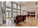 Bright and airy living room with a fireplace, large windows, and hardwood floors for a comfortable living space at 525 Water Shadow Ln, Alpharetta, GA 30022
