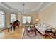 Comfortable living room featuring a piano, a sofa, a stylish coffee table, and ample natural light at 525 Water Shadow Ln, Alpharetta, GA 30022