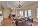 Comfortable living room with hardwood floors, fireplace, and ample seating at 525 Water Shadow Ln, Alpharetta, GA 30022