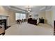 Spacious main bedroom with decorative trey ceiling, fireplace, and large windows at 525 Water Shadow Ln, Alpharetta, GA 30022