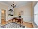 Classic office with hardwood floors, built-in bookcase, area rug, and traditional desk at 525 Water Shadow Ln, Alpharetta, GA 30022