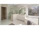 Bright bathroom featuring a soaking tub and glass shower, with a beautiful view at 760 Valley Summit Drive, Roswell, GA 30075