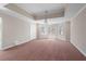 Spacious bedroom with neutral walls, plush carpet, tray ceiling, and natural light from large windows at 760 Valley Summit Drive, Roswell, GA 30075