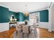 Elegant dining room with hardwood floors, beautiful chandelier, and soothing wall color perfect for gatherings at 760 Valley Summit Drive, Roswell, GA 30075