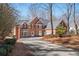 Charming brick home with a well-manicured lawn and a spacious driveway; a welcoming sight for potential buyers at 760 Valley Summit Drive, Roswell, GA 30075