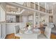 Open-concept kitchen and dining area with stainless steel appliances and hardwood floors at 760 Valley Summit Drive, Roswell, GA 30075