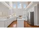 Bright and airy kitchen with stainless steel appliances, an island cooktop, and an abundance of natural light at 760 Valley Summit Drive, Roswell, GA 30075