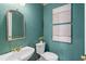 Stylish powder room with a unique vanity, mirror, and decorative wallpaper at 760 Valley Summit Drive, Roswell, GA 30075