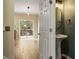 Half bath with pedestal sink and modern lighting located off the main living area at 1536 Liberty Nw Pkwy, Atlanta, GA 30318