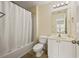 Well-lit bathroom featuring a shower-tub combo and vanity with a modern sink at 1536 Liberty Nw Pkwy, Atlanta, GA 30318