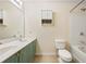 Bright bathroom with a double sink vanity and a shower-tub combination at 1536 Liberty Nw Pkwy, Atlanta, GA 30318