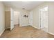 Open bedroom area with three doors, wood look floors, and neutral wall colors at 1536 Liberty Nw Pkwy, Atlanta, GA 30318