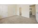 Spacious bedroom with neutral carpet and adjoining bathroom at 1536 Liberty Nw Pkwy, Atlanta, GA 30318