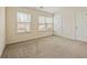 Bedroom with natural light, carpet and two large windows at 1536 Liberty Nw Pkwy, Atlanta, GA 30318
