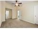 Spacious bedroom with carpet, ceiling fan, neutral walls, and two entryways at 1536 Liberty Nw Pkwy, Atlanta, GA 30318