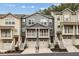 Exterior of townhouses with garages, stairs, and individually painted exterior at 1536 Liberty Nw Pkwy, Atlanta, GA 30318