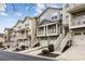 Townhouse complex with individually painted homes, stairs, and front-entry garages at 1536 Liberty Nw Pkwy, Atlanta, GA 30318