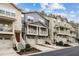 Exterior elevation of attached townhouse with driveways, garages, and individual stairs at 1536 Liberty Nw Pkwy, Atlanta, GA 30318