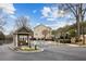 Charming gated entrance to the neighborhood with neatly landscaped flower beds at 1536 Liberty Nw Pkwy, Atlanta, GA 30318