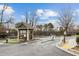 Gated neighborhood entrance with colorful landscaping at the guard house at 1536 Liberty Nw Pkwy, Atlanta, GA 30318