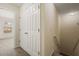 Hallway shot with a coat closet at the top of the stairs and a view to the carpeted bedroom at 1536 Liberty Nw Pkwy, Atlanta, GA 30318