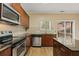 Kitchen features stainless steel appliances, granite countertops, wood cabinets and a deck view at 1536 Liberty Nw Pkwy, Atlanta, GA 30318