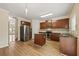 Open kitchen with wood cabinetry, stainless steel appliances, granite countertops, and center island at 1536 Liberty Nw Pkwy, Atlanta, GA 30318