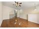 Spacious open living room featuring hardwood floors, neutral paint, and a ceiling fan at 1536 Liberty Nw Pkwy, Atlanta, GA 30318