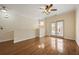 Bright living room featuring hardwood floors, natural light and access to outdoor balcony at 1536 Liberty Nw Pkwy, Atlanta, GA 30318
