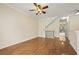 Spacious open living room featuring hardwood floors, neutral paint, and a ceiling fan at 1536 Liberty Nw Pkwy, Atlanta, GA 30318
