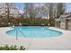 Sparkling community pool surrounded by a spacious deck with lots of room for sunbathing at 1536 Liberty Nw Pkwy, Atlanta, GA 30318
