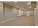 Finished basement featuring neutral walls, plush carpeting, and ample space for entertaining and relaxing at 4129 Lansfaire Ter, Suwanee, GA 30024