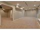 Large finished basement featuring plush carpeting, neutral walls, and multiple access points at 4129 Lansfaire Ter, Suwanee, GA 30024