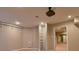 Finished basement with projector, screen, and ladder leading to additional storage at 4129 Lansfaire Ter, Suwanee, GA 30024