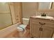 Bathroom featuring toilet with blue tape, sink and vanity, gold fixtures, and shower at 4129 Lansfaire Ter, Suwanee, GA 30024