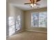 Bedroom with ceiling fan and large window at 4129 Lansfaire Ter, Suwanee, GA 30024