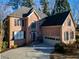 Charming brick two-story home with manicured lawn and two-car garage at 4129 Lansfaire Ter, Suwanee, GA 30024