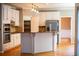 Stylish kitchen with white cabinets, granite countertops, and stainless steel appliances at 4129 Lansfaire Ter, Suwanee, GA 30024