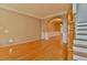 Bright living room features hardwood floors, decorative columns, and wainscoting at 4129 Lansfaire Ter, Suwanee, GA 30024